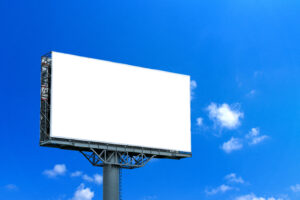 large billboard for advertising with blue sky and white clouds in the background